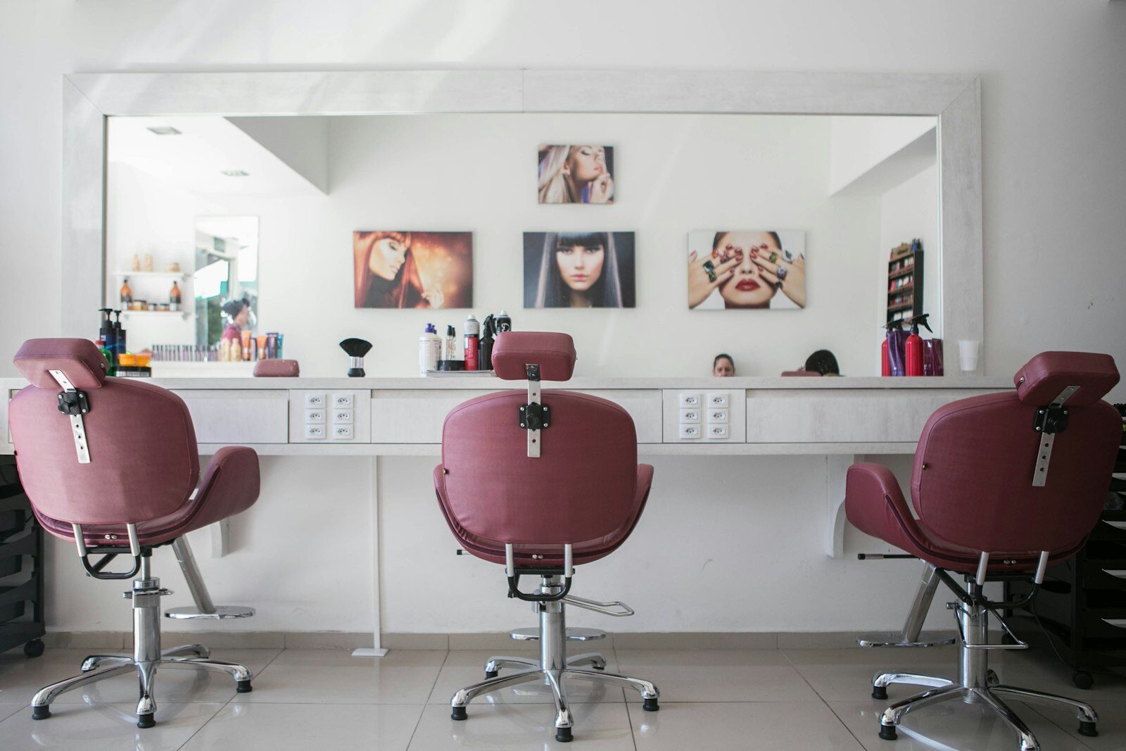 Bright, minimal salon interior with a styling chair and mirror