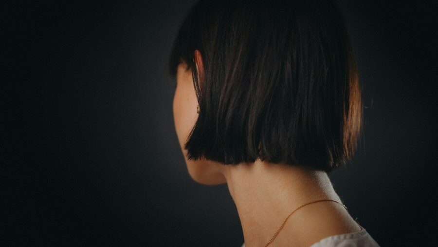 Sleek, glossy dark bob seen from behind