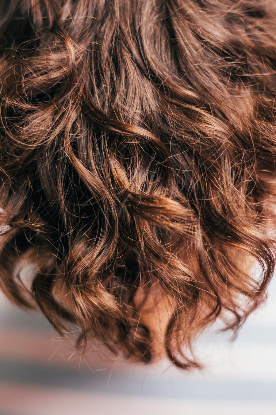 Close-up of glossy copper and brown curls
