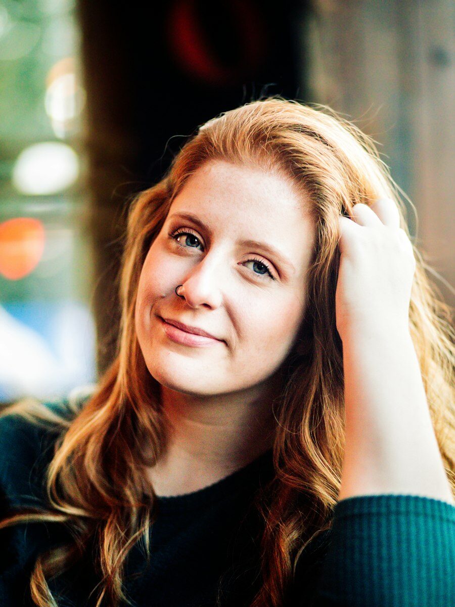 Portrait of Jess van der Merwe with long, copper-red hair