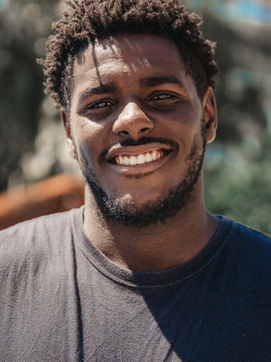 Portrait of Sipho Ndlovu smiling outdoors